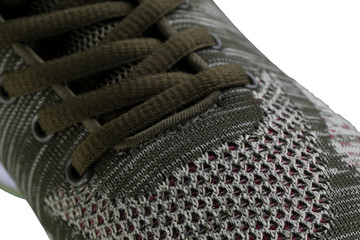 Fragment of a brown sneaker close up. Sneaker texture