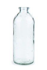 Empty transparent glass bottle isolated on white background