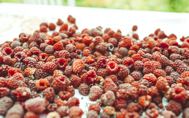 Beautiful photo of raspberry fruits on paper.