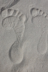 Skagen, Denmark Rabjerg Mile, a wandering migrating sand dune outside of Skagen and bare footsteps in the sand.