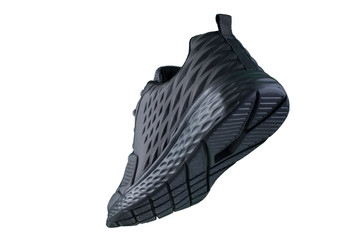 Black sneakers with a white sole side view on a white background