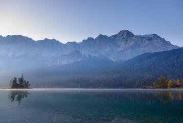 Reflections of the sunrise at the Eibsee