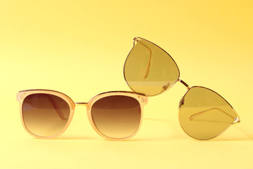 set of sunglasses on a colored background 