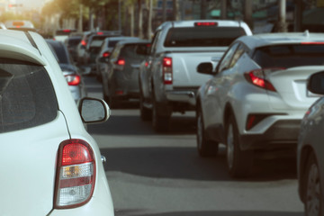 Luxury of white car stop on the asphalt junction by traffic light control in across. Traveling in the provinces during the bright period. Open light brake.