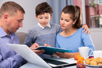 Woman with son meeting financial adviser