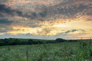 landscape bright colorful clouds in the light of the sunset