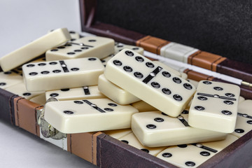 A suitcase with dominoes for meetings with family and friends.