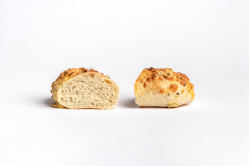 Freshly baked bread rolls isolated on white background.