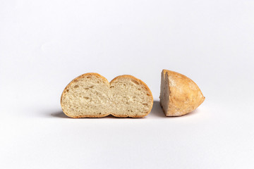 Freshly baked bread rolls isolated on white background.