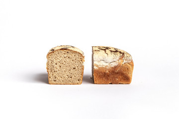 Fresh home-made bread with a crispy crust, on white background.