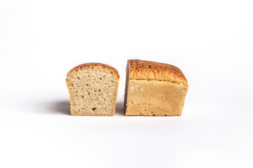 Fresh home-made bread with a crispy crust, on white background.