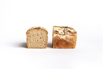 Fresh home-made bread with a crispy crust, on white background.