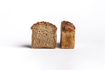 Fresh home-made bread with a crispy crust, on white background.