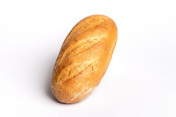 Fresh home-made bread with a crispy crust, on white background.