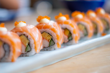 Salmon sushi roll, Japanese food. (selective focus point)