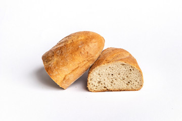 Fresh home-made bread with a crispy crust, on white background.