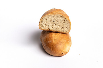 Fresh home-made bread with a crispy crust, on white background.