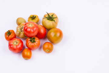 Red tomatoes - white background.