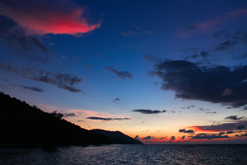 Colorful sunset over the Ocean on Kri Island, Raja Ampat, south-east Asia.