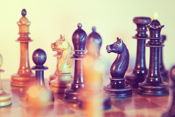  Old wooden chessmen on the chess board