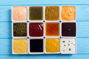 Set of different sauces in ceramic bowl