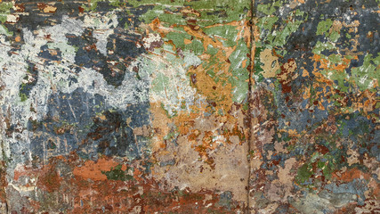 plastered wall, with old multi-colored paint with green, red, gray shades