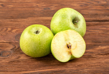 Green apple with half