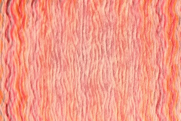 Texture of fabric, background close-up of live coral color with wavy stripes