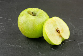 Green apple with half
