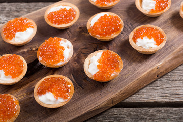 Tartalets with red caviar
