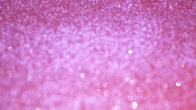 Pink glitter. Abstract background with shiny bokeh sparkles, bokeh background. Abstract shine. 