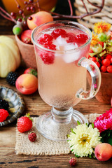 Homemade fruit lemonade with icecubes.