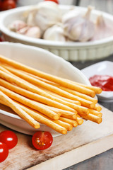 Traditional italian breadsticks on wooden table.