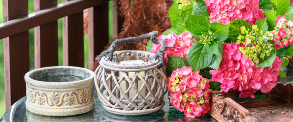 Balcony decoration with hydrangea flowers and lanterns.