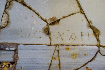 The inscriptions on the marble floor.