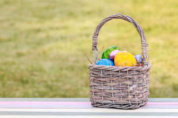 Basket with colorful Easter eggs.
