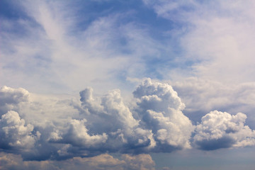 Fototapeta na wymiar white Cumulus clouds against a bright blue sky