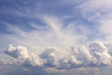 Fototapeta premium white Cumulus clouds against a bright blue sky