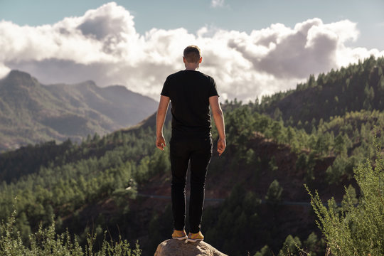 Happy Young Tall Man From Behind Standing And Enjoying Life In The Mountains Of Gran Canaria, Canary Islands, Spain