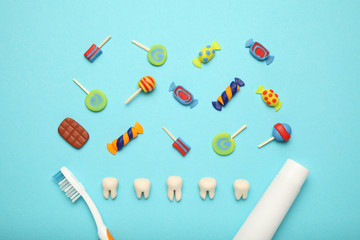 Teeth with sweet candies. Tooth caries in children's, dental healthcare, toothpaste and toothbrush.