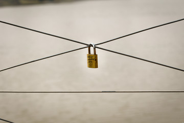 Padlock with love writings on bridge