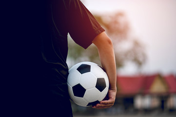 The cropped image of sports players who catch the ball and the football field. Sports-image concept.