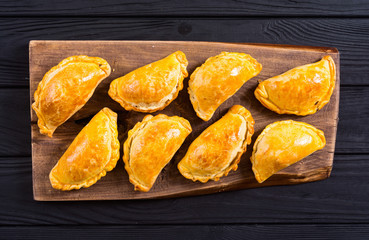 Latin American baked beef empanadas with sauce