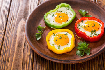 Yellow , red and green pepper with fried eggs