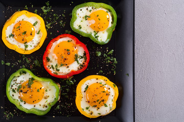 Yellow , red and green pepper with fried eggs