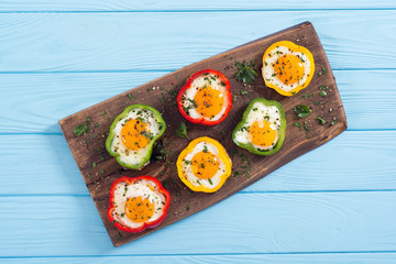Yellow , red and green pepper with fried eggs
