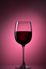 Red A Berry Drink Or Red Wine Into A Glass Goblet On A Background.