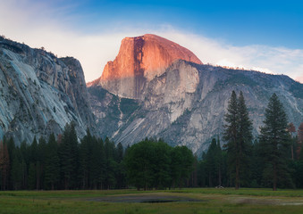 Yosemite National Park view of Half Dome from the Valley during colorful sunset with trees and rocks. California, USA Amazing day in the most popular place in Yosemite. Beautiful landscape background