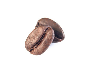 two coffee beans are stacked isolated on white background