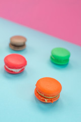 Close-up shot of colored macaroons in different position